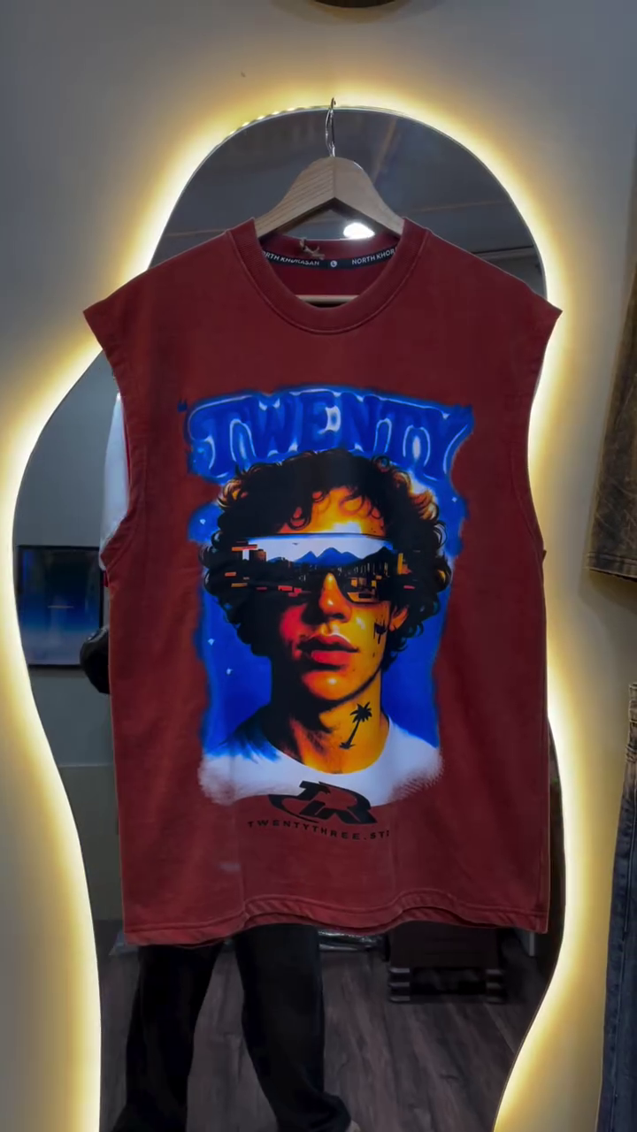 Edgy Streetwear Vibes: Graphic Sleeveless Tee with Bold Artistic Expression