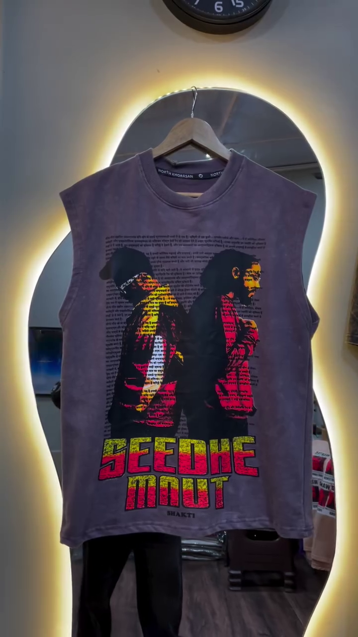 Edgy Streetwear Vibes: Graphic Sleeveless Tee with Bold Artistic Expression