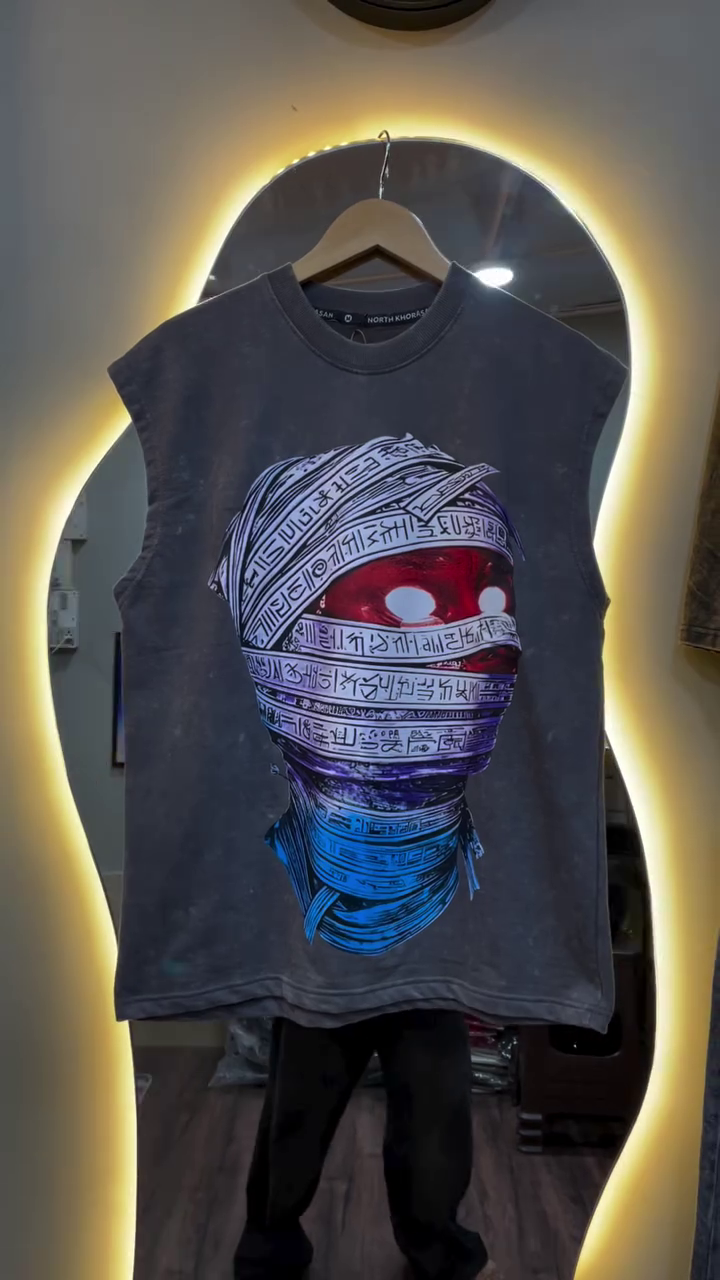 Edgy Streetwear Vibes: Graphic Sleeveless Tee with Bold Artistic Expression