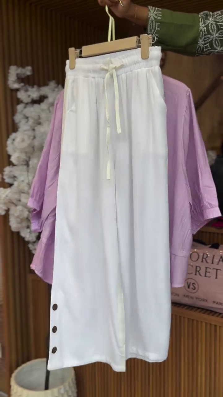 Soft Elegance: Pastel Embroidered Top with Relaxed White Trousers