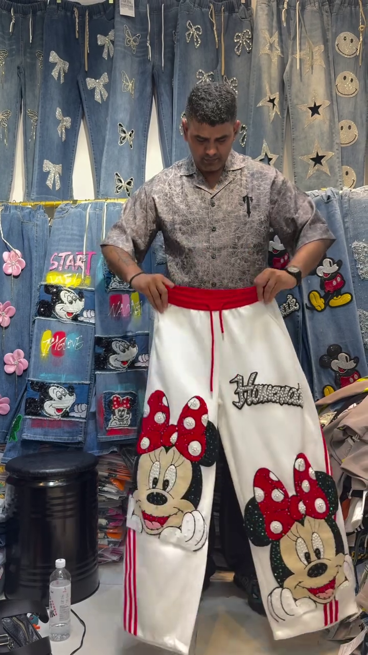Trendy Wide-Leg Cartoon Print Pants with Sparkling Bow Details and Bold Red Accents for a Fun Streetwear Look