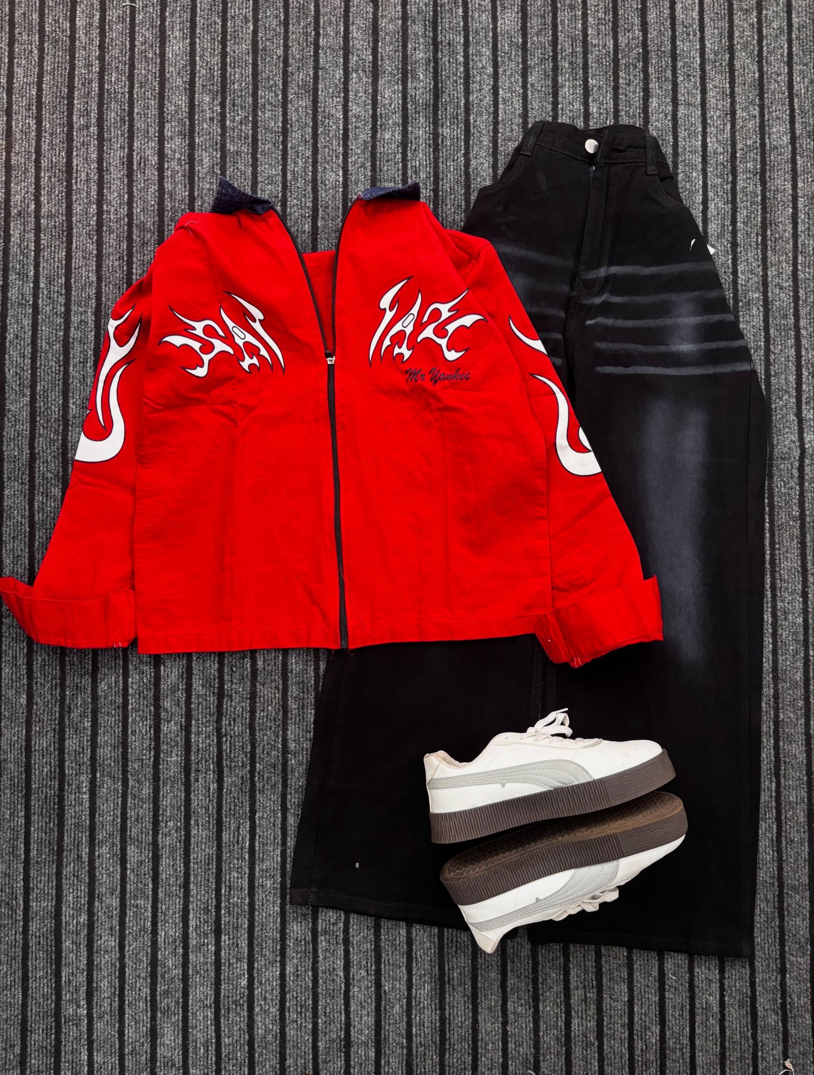 Trendy  Graphic Zip-Up Jacket with Black Wide-Leg Jeans – Stylish Streetwear Outfit