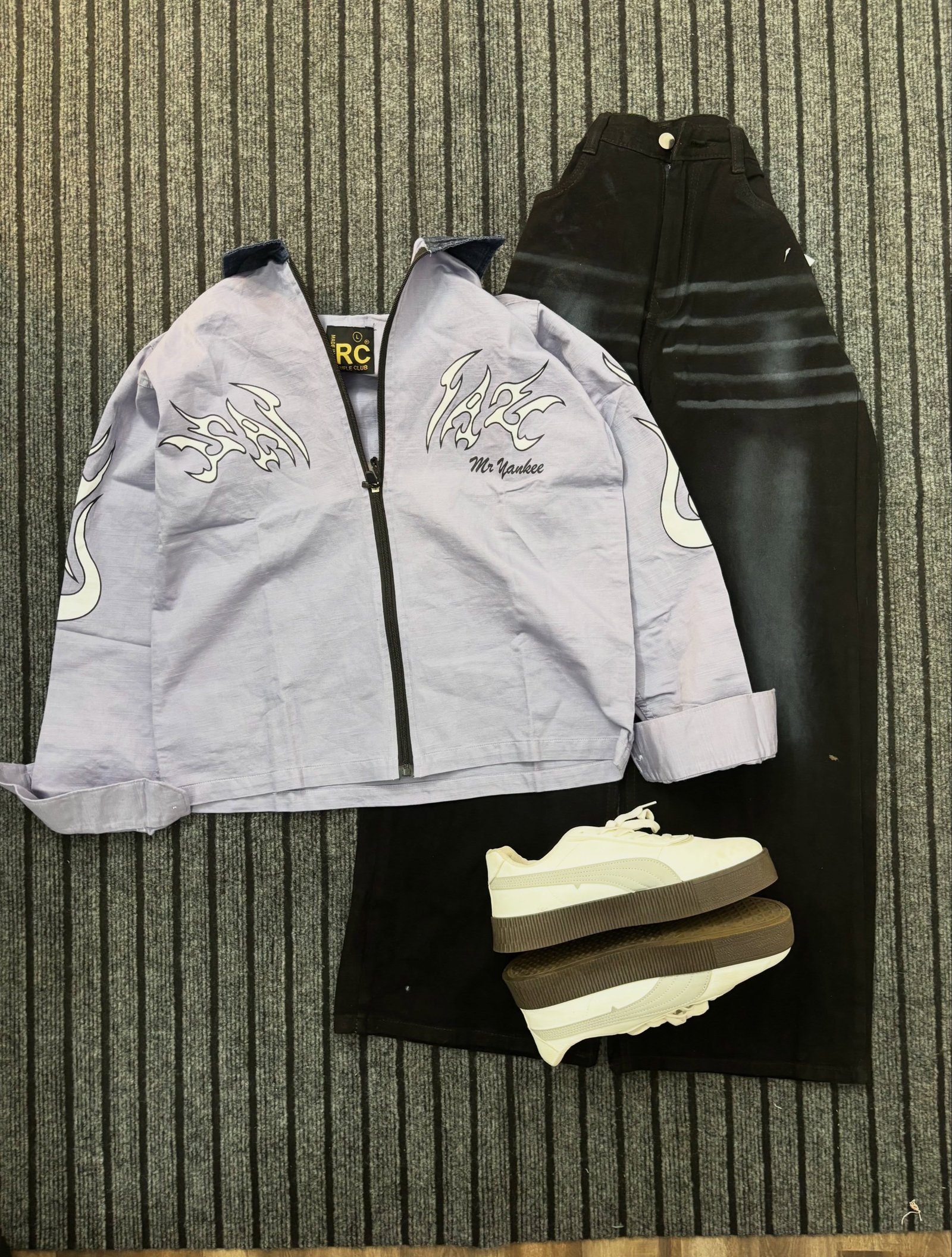 Trendy  Graphic Zip-Up Jacket with Black Wide-Leg Jeans – Stylish Streetwear Outfit
