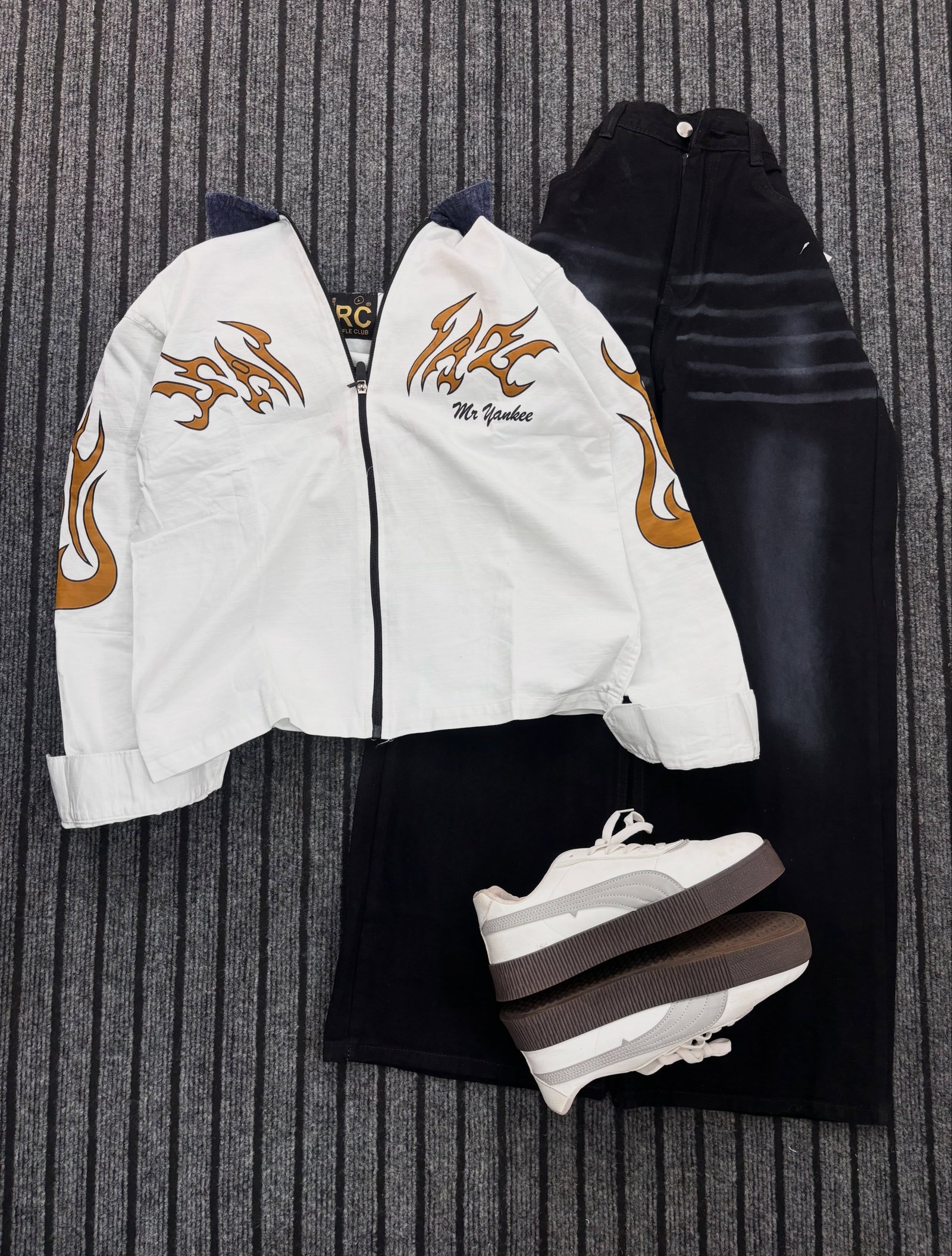 Trendy  Graphic Zip-Up Jacket with Black Wide-Leg Jeans – Stylish Streetwear Outfit