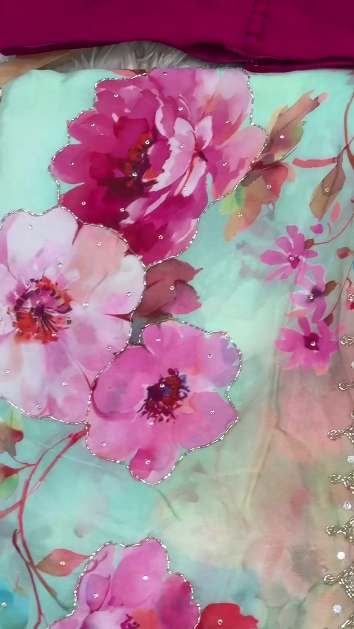 Elegant Mint Green Floral Saree with Golden Embellishments and a Stylish Magenta Blouse
