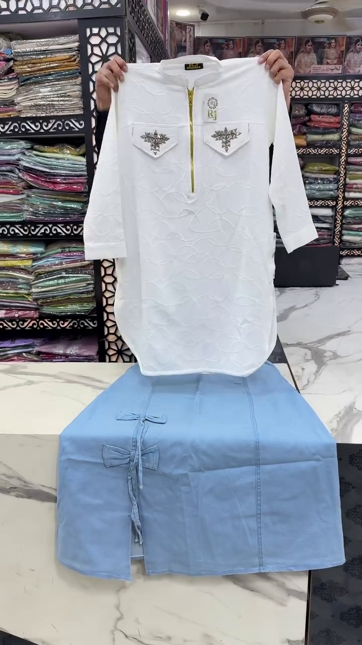 Elegant White Textured Kurta with Golden Zipper and Embellished Pockets Paired with a Stylish Light Blue Bottom